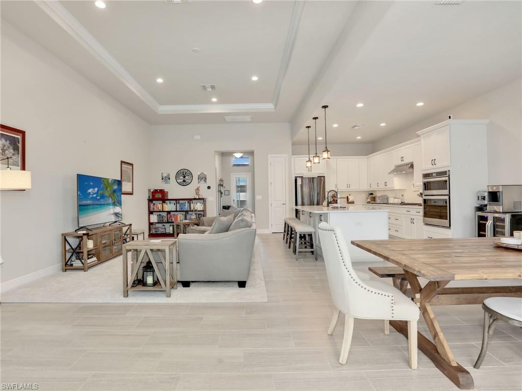 10047 Florence Circle Naples, FL 34119 - Photo 19 of 37 a view of kitchen with dining table and chairs