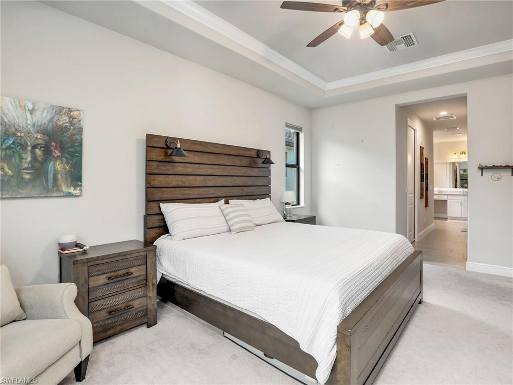 10047 Florence Circle Naples, FL 34119 - Photo 22 of 37 a large white bed in a white room