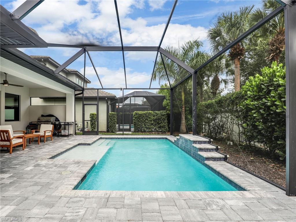 10047 Florence Circle Naples, FL 34119 - Photo 35 of 37 a view of a backyard with sitting area