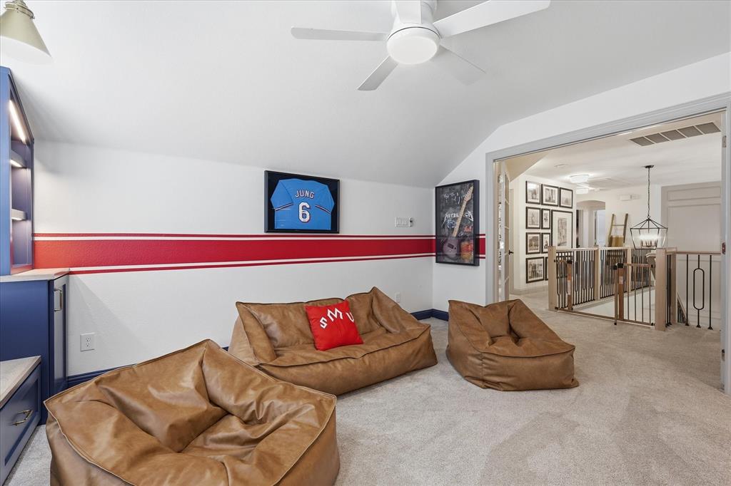 944 Spring Creek Drive Grapevine, TX 76051 - Photo 26 of 37 The Kid's Retreat or Gameroom with Doors to Enclose the Room. Go Rangers!