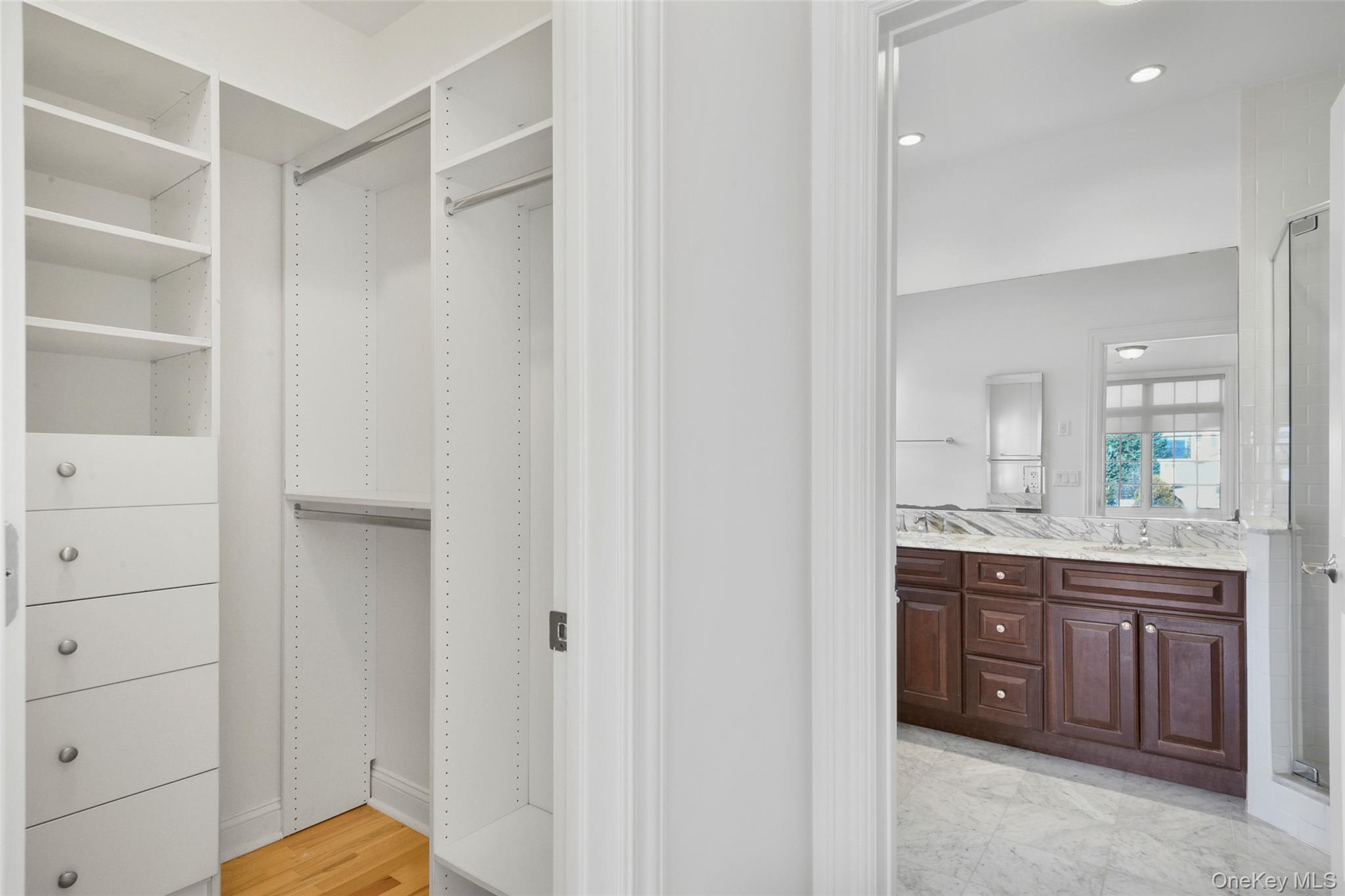 55 1st Street, Unit 207 Pelham, NY 10803 - Photo 16 of 23 Walk in closet with a view to the primary bath