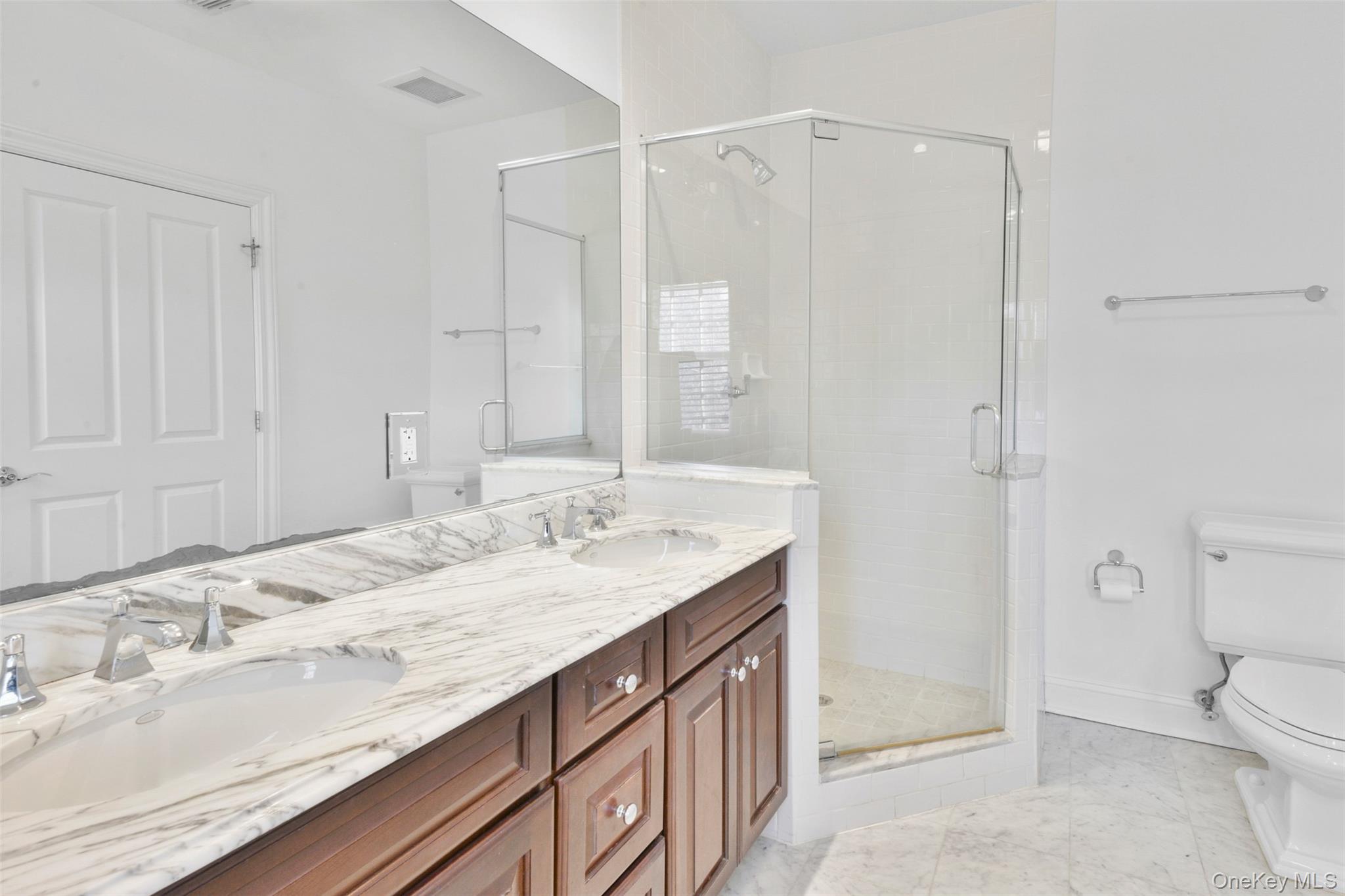 55 1st Street, Unit 207 Pelham, NY 10803 - Photo 18 of 23 Bathroom with a stall shower and double vanity