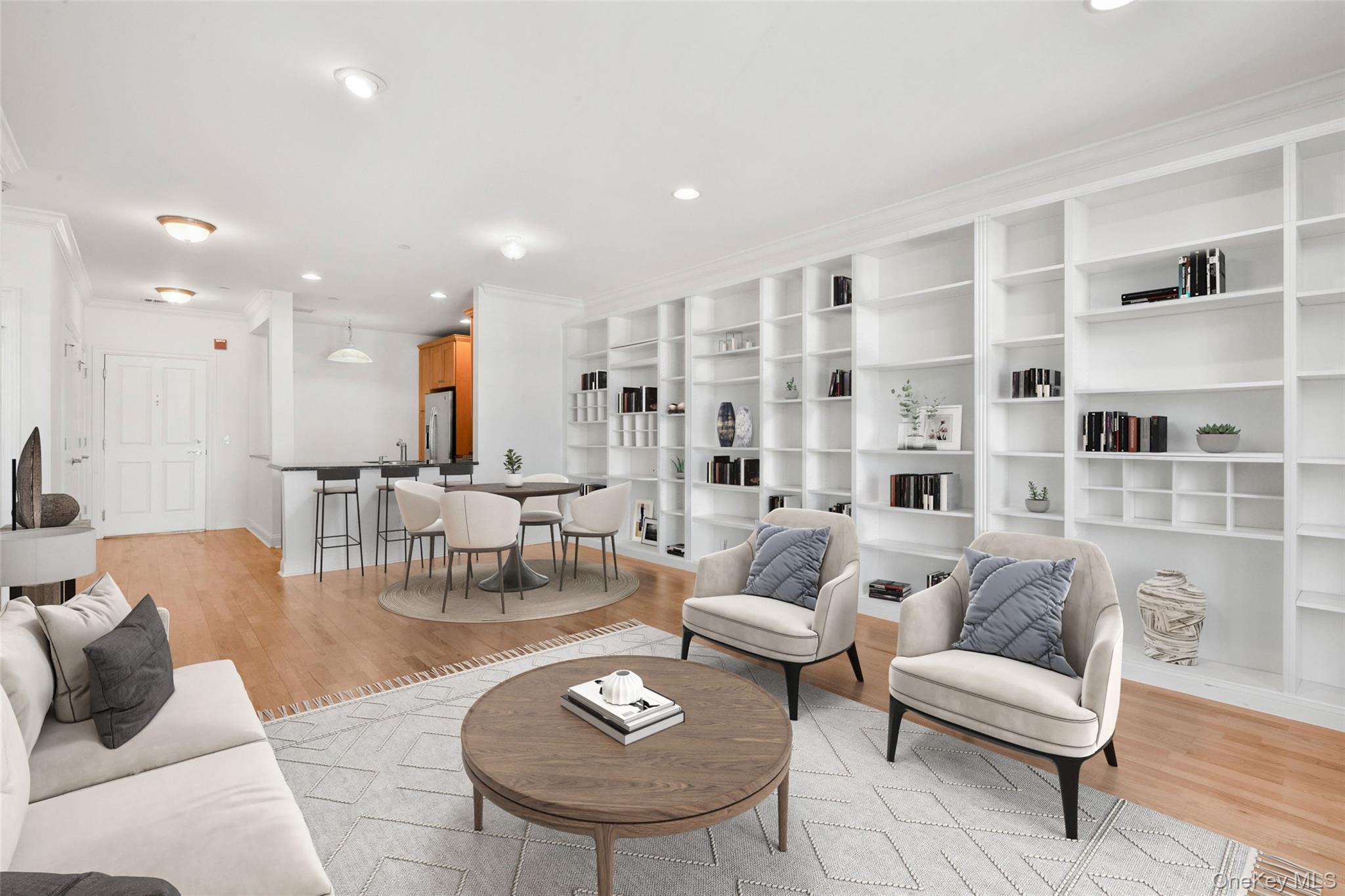 55 1st Street, Unit 207 Pelham, NY 10803 - Photo 2 of 23 Living room with light wood-style floors, recessed lighting, and crown molding