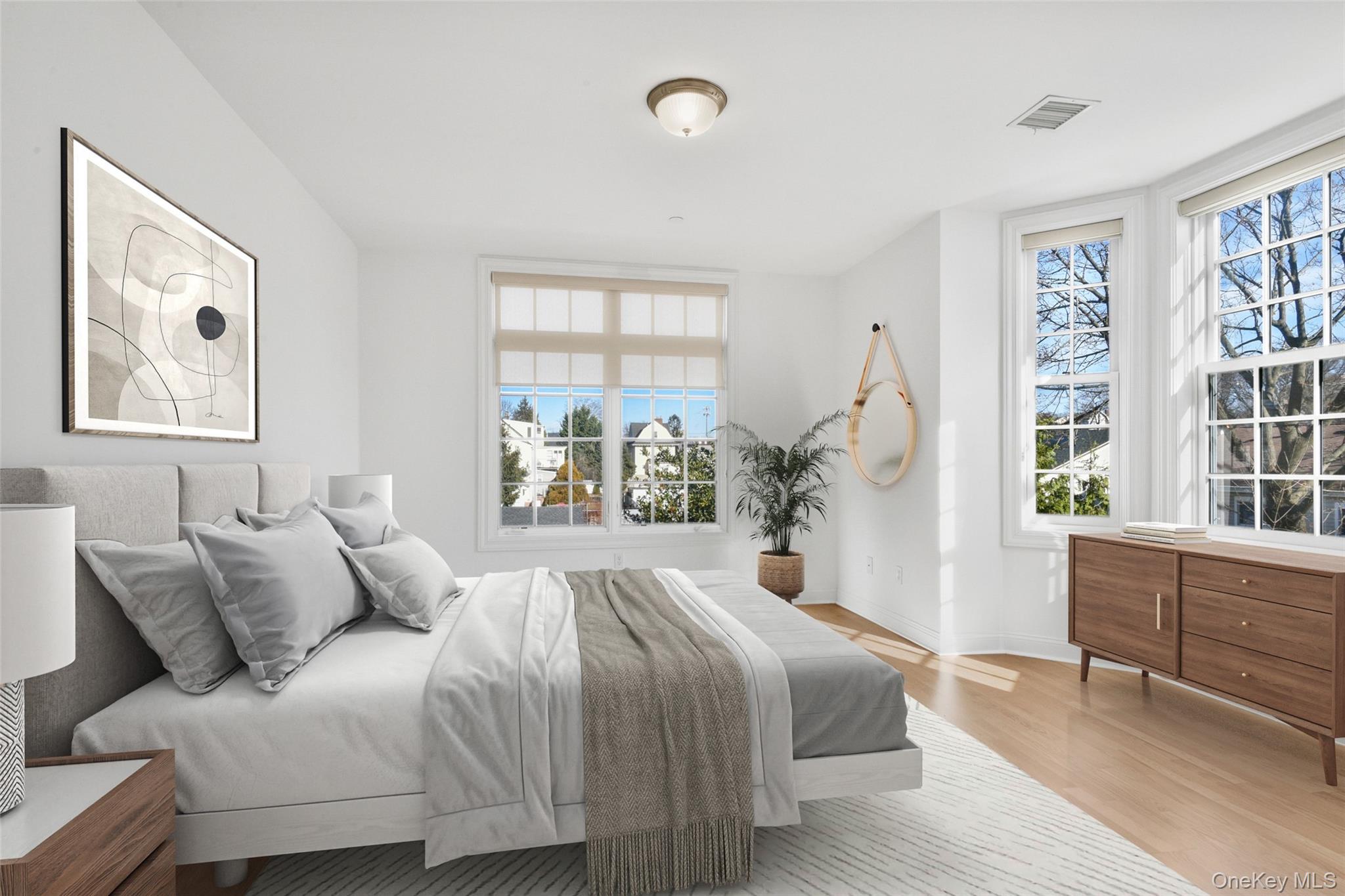 55 1st Street, Unit 207 Pelham, NY 10803 - Photo 8 of 23 Bedroom featuring light wood finished floors and baseboards
