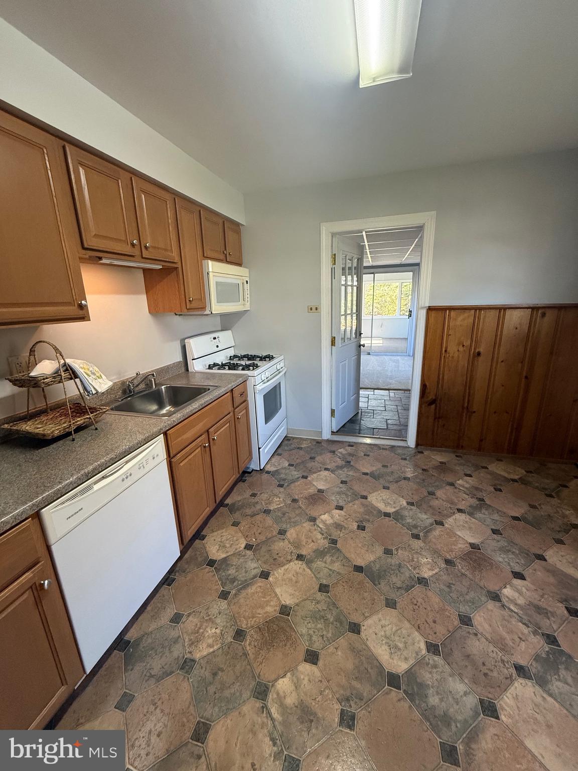 2 Stevens Road Glen Burnie, MD 21060 - Photo 11 of 27 a kitchen with a sink stove and cabinets