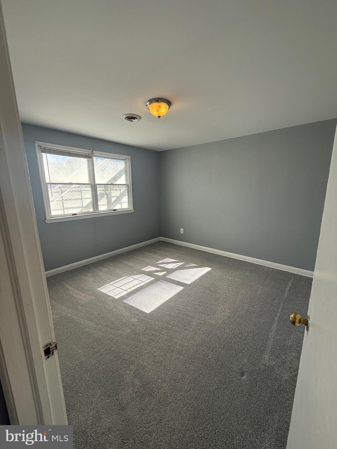2 Stevens Road Glen Burnie, MD 21060 - Photo 14 of 27 an empty room with windows and entrance