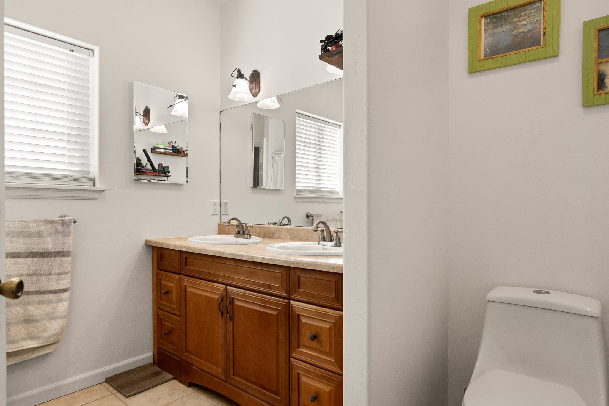 42 Eagle Court Parachute, CO 81635 - Photo 12 of 30 a bathroom with a toilet a sink a mirror and a window