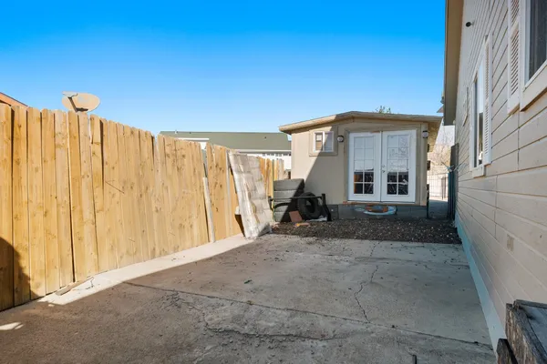 a view of a house with a backyard