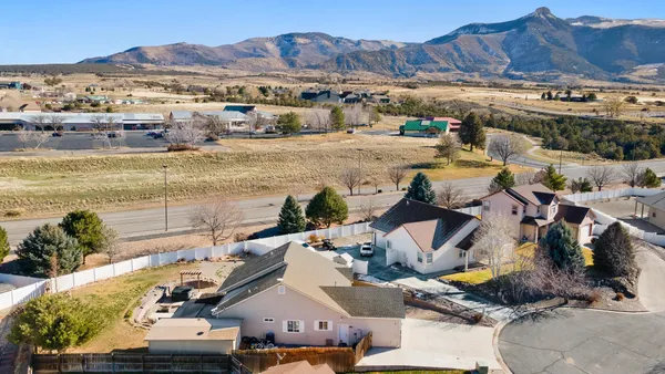 an aerial view of residential houses with outdoor space