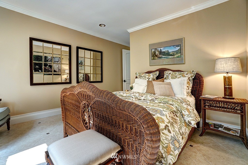 25205 Northeast 39th Way Redmond, WA 98053 - Photo 19 of 25 a bedroom with a bed two lamps and a large mirror next to a window