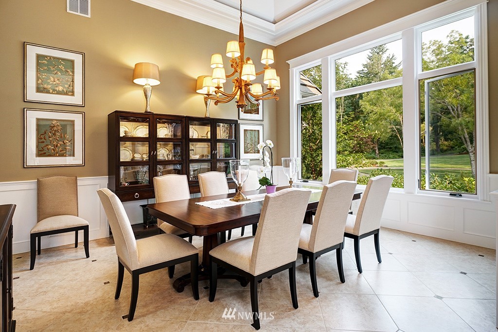 25205 Northeast 39th Way Redmond, WA 98053 - Photo 6 of 25 a view of a dining room with furniture large windows and wooden floor