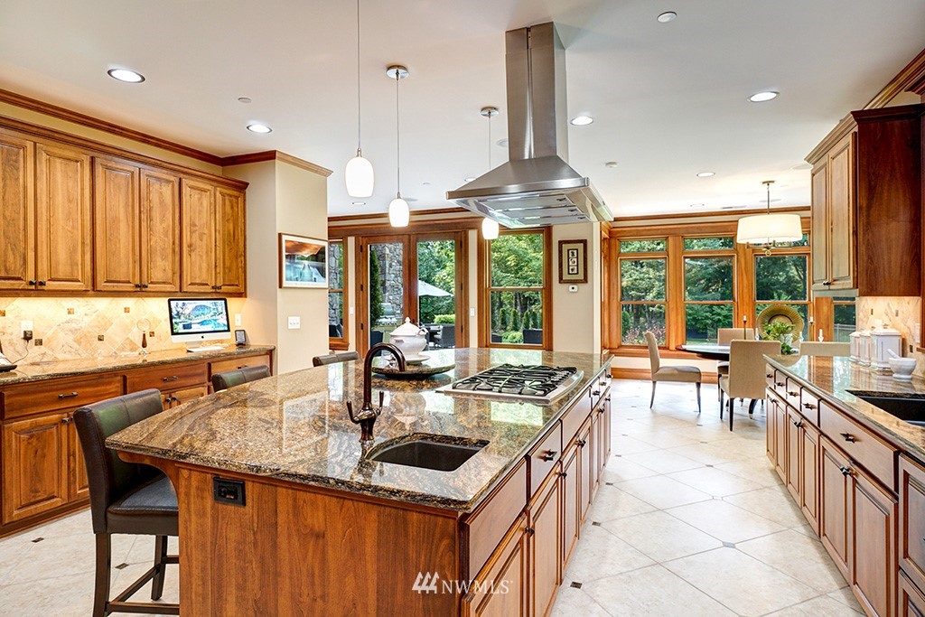 25205 Northeast 39th Way Redmond, WA 98053 - Photo 8 of 25 a kitchen with stainless steel appliances granite countertop a sink and a large window