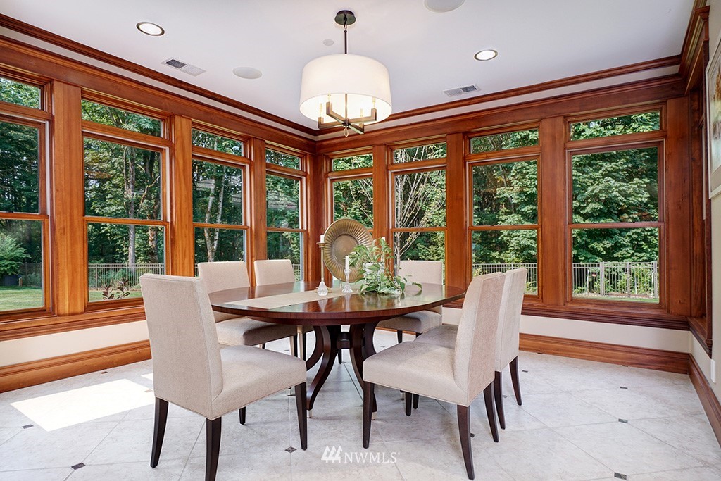 25205 Northeast 39th Way Redmond, WA 98053 - Photo 9 of 25 a dining room with furniture a chandelier and wooden floor