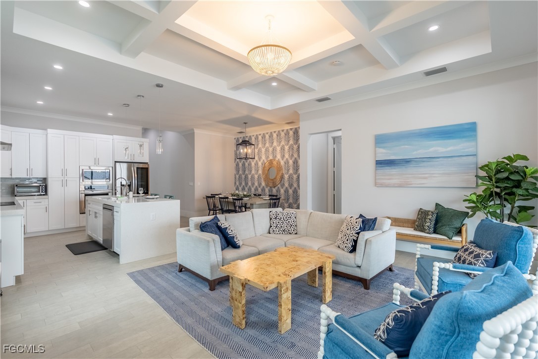 795 108th Avenue North Naples, FL 34108 - Photo 16 of 50 a living room with furniture and a large window