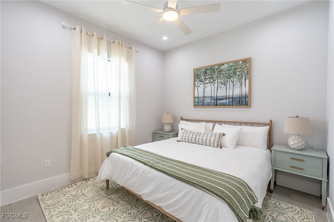 795 108th Avenue North Naples, FL 34108 - Photo 27 of 50 a bedroom with a bed and a window