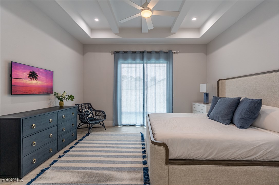 795 108th Avenue North Naples, FL 34108 - Photo 28 of 50 a bedroom with a bed and a dresser