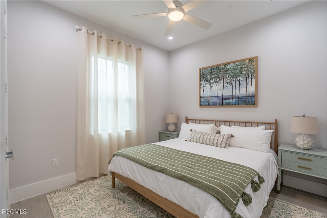 795 108th Avenue North Naples, FL 34108 - Photo 32 of 50 a bedroom with a large bed and a window