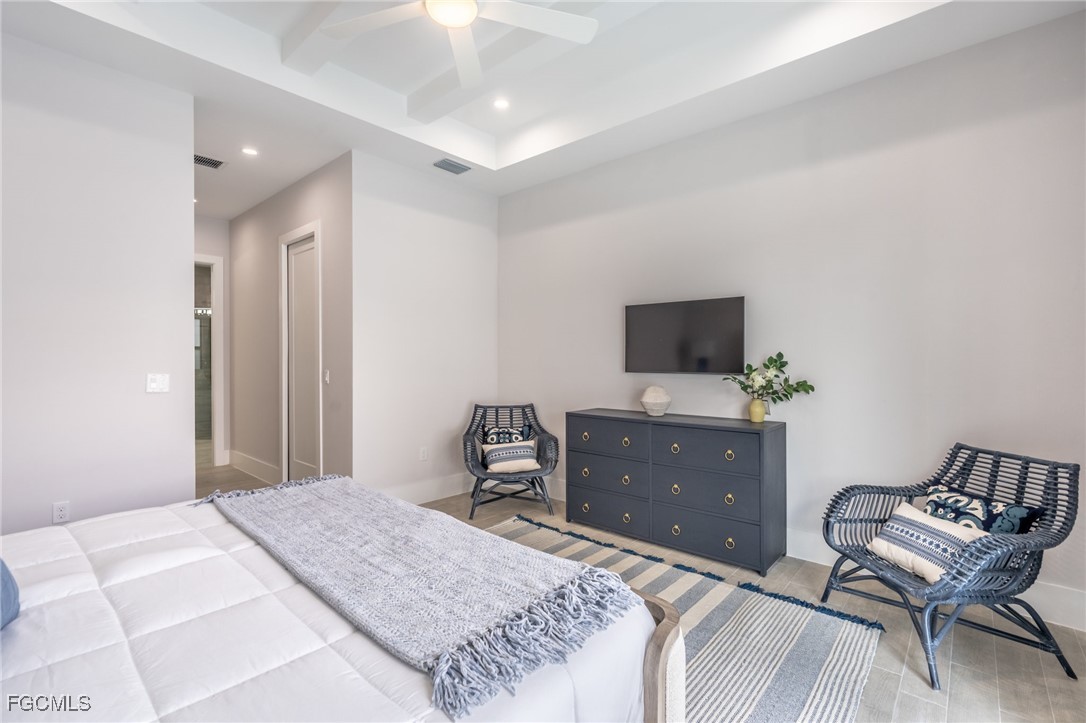 795 108th Avenue North Naples, FL 34108 - Photo 33 of 50 a bedroom with a bed and a flat screen tv