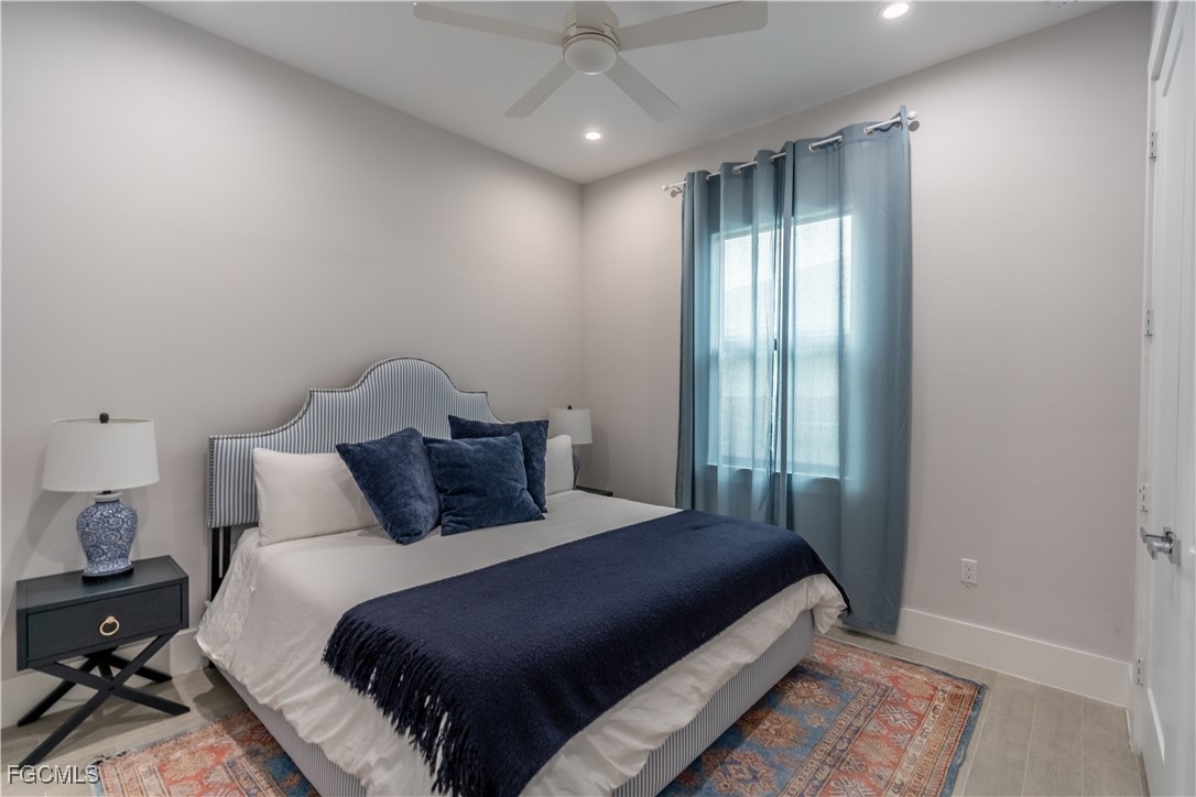 795 108th Avenue North Naples, FL 34108 - Photo 35 of 50 a bedroom with a bed and a window