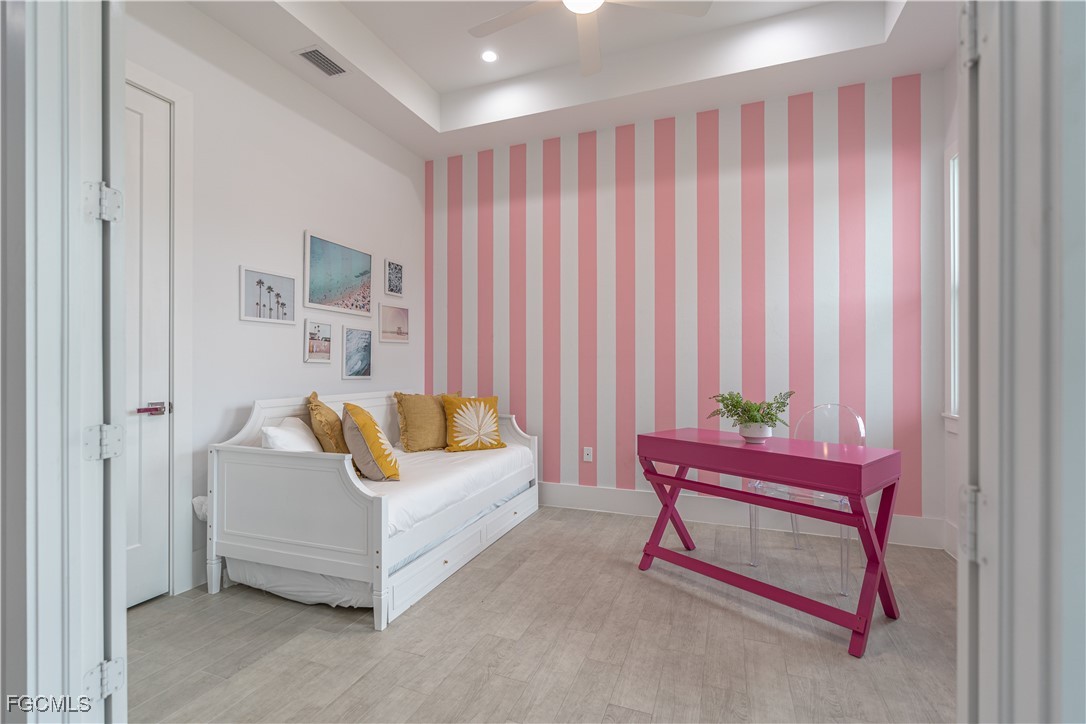 795 108th Avenue North Naples, FL 34108 - Photo 36 of 50 a living room with furniture and a curtain
