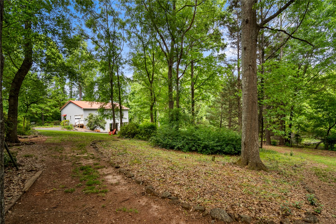 324 Hobson Road Anderson, SC 29621 - Photo 38 of 46 This tranquil woodland retreat offers a private setting, surrounded by mature trees.
