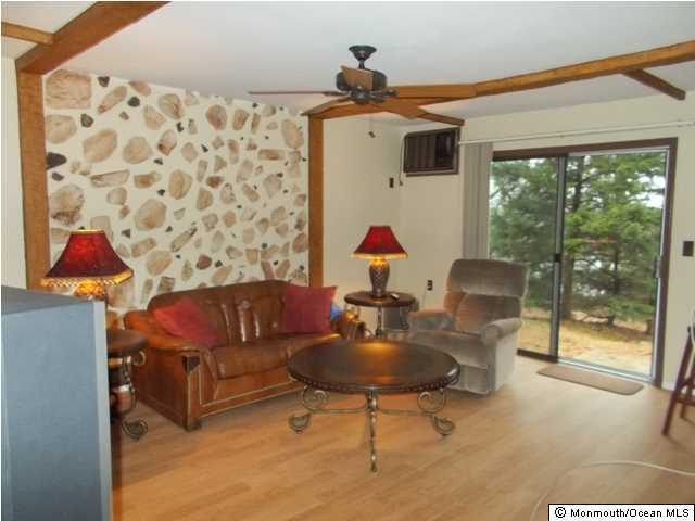 1761 Forge Pond Road Brick, NJ 08724 - Photo 4 of 12 a living room with furniture and a window