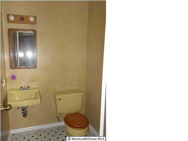 1761 Forge Pond Road Brick, NJ 08724 - Photo 8 of 12 a bathroom with a toilet and a sink