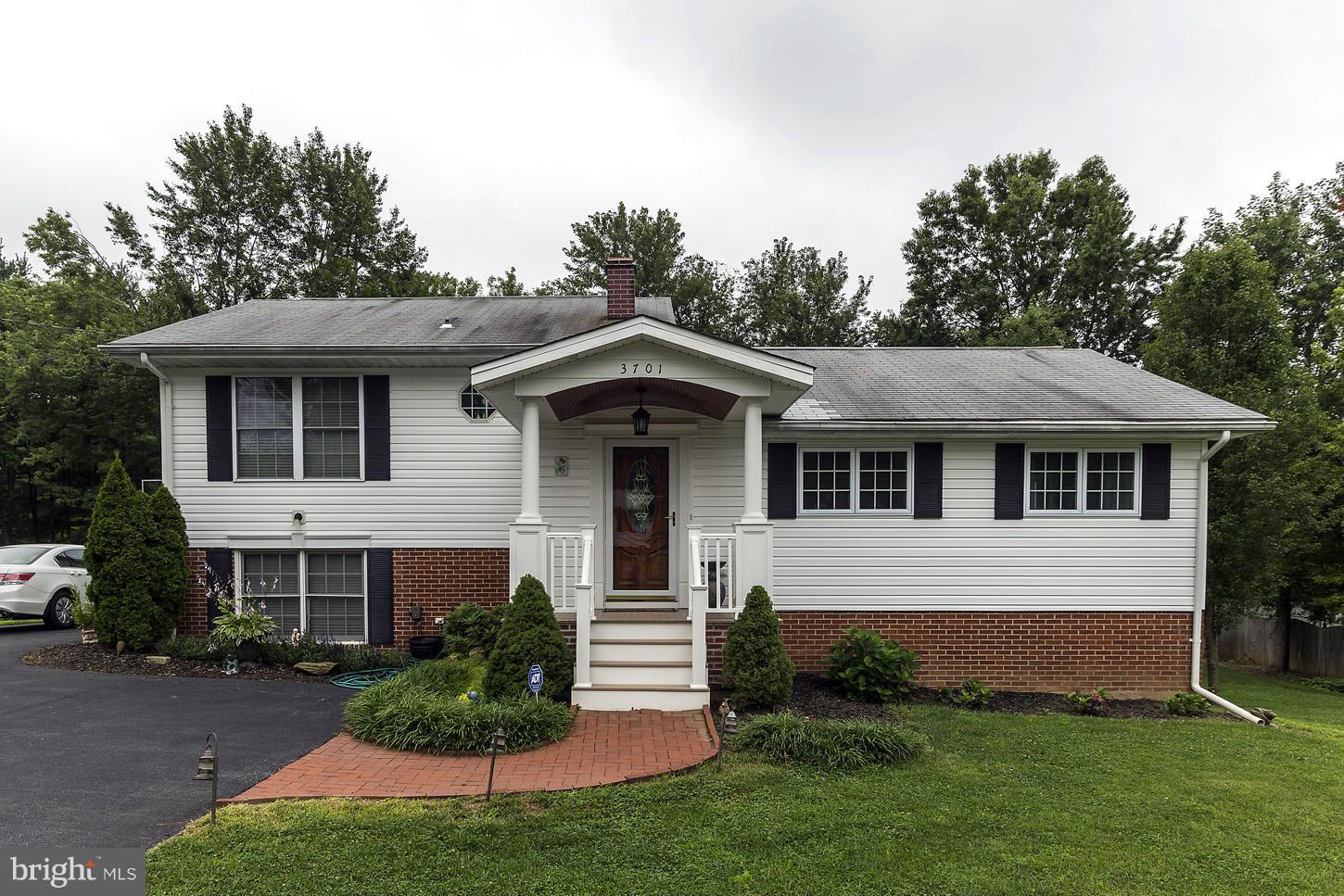 3701 Altondale Road Reisterstown, MD 21136 - Photo 1 of 29 a front view of a house with a yard