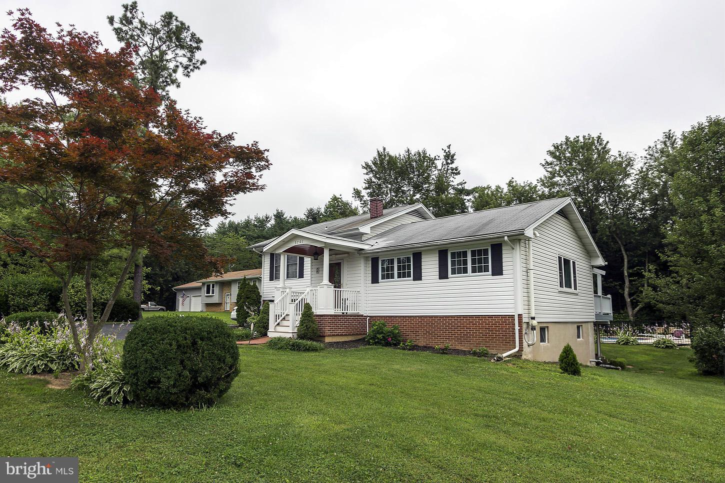 3701 Altondale Road Reisterstown, MD 21136 - Photo 2 of 29 a front view of a house with a garden