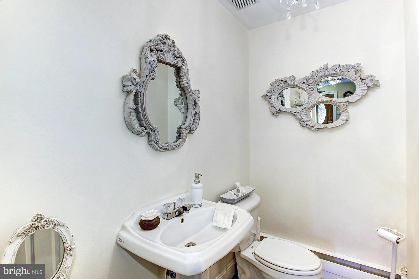 3701 Altondale Road Reisterstown, MD 21136 - Photo 12 of 29 a bathroom with a toilet sink and mirror