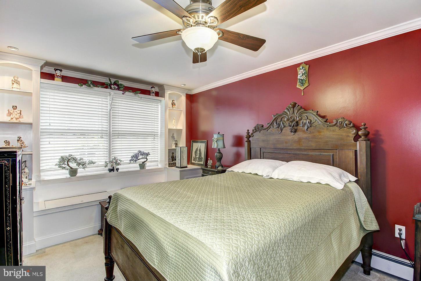 3701 Altondale Road Reisterstown, MD 21136 - Photo 15 of 29 a bedroom with a bed and a chandelier
