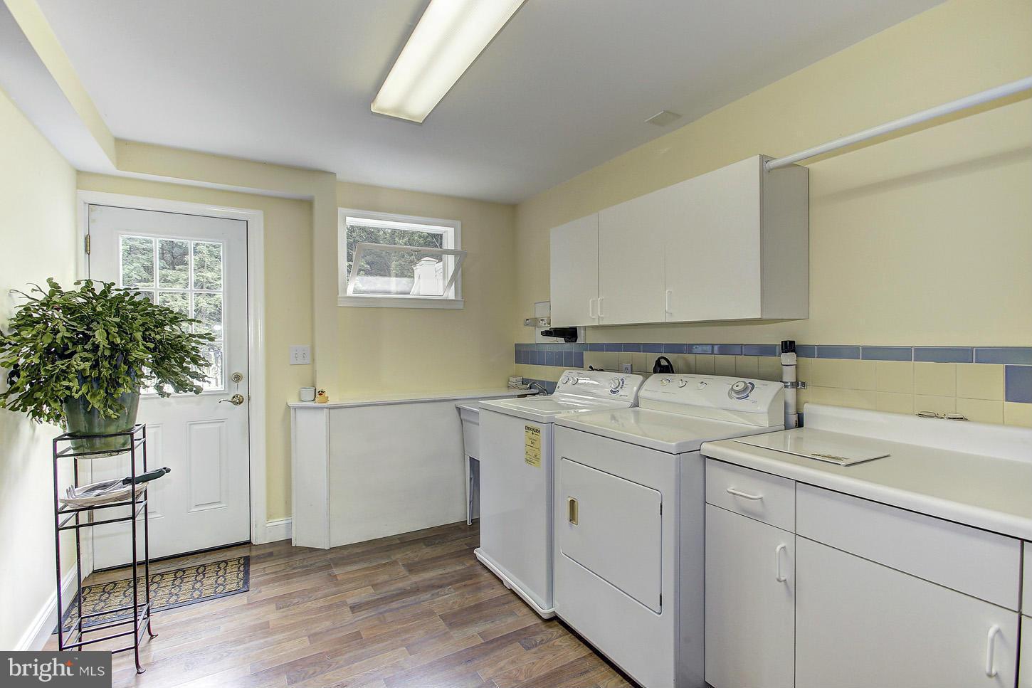 3701 Altondale Road Reisterstown, MD 21136 - Photo 18 of 29 a utility room with cabinets washer and dryer