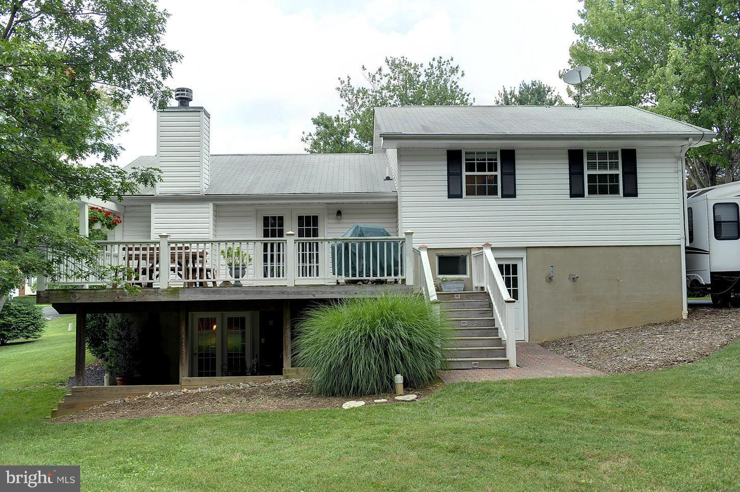 3701 Altondale Road Reisterstown, MD 21136 - Photo 21 of 29 a view of a house with a sink and a yard with potted plants