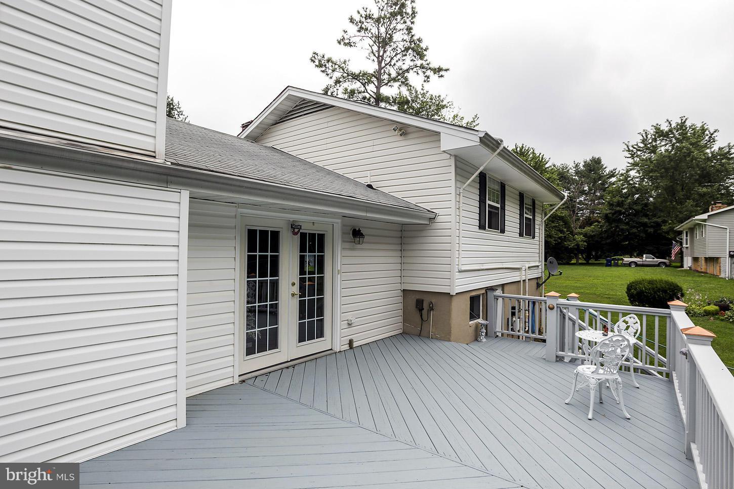 3701 Altondale Road Reisterstown, MD 21136 - Photo 22 of 29 a view of a house with a patio and a yard