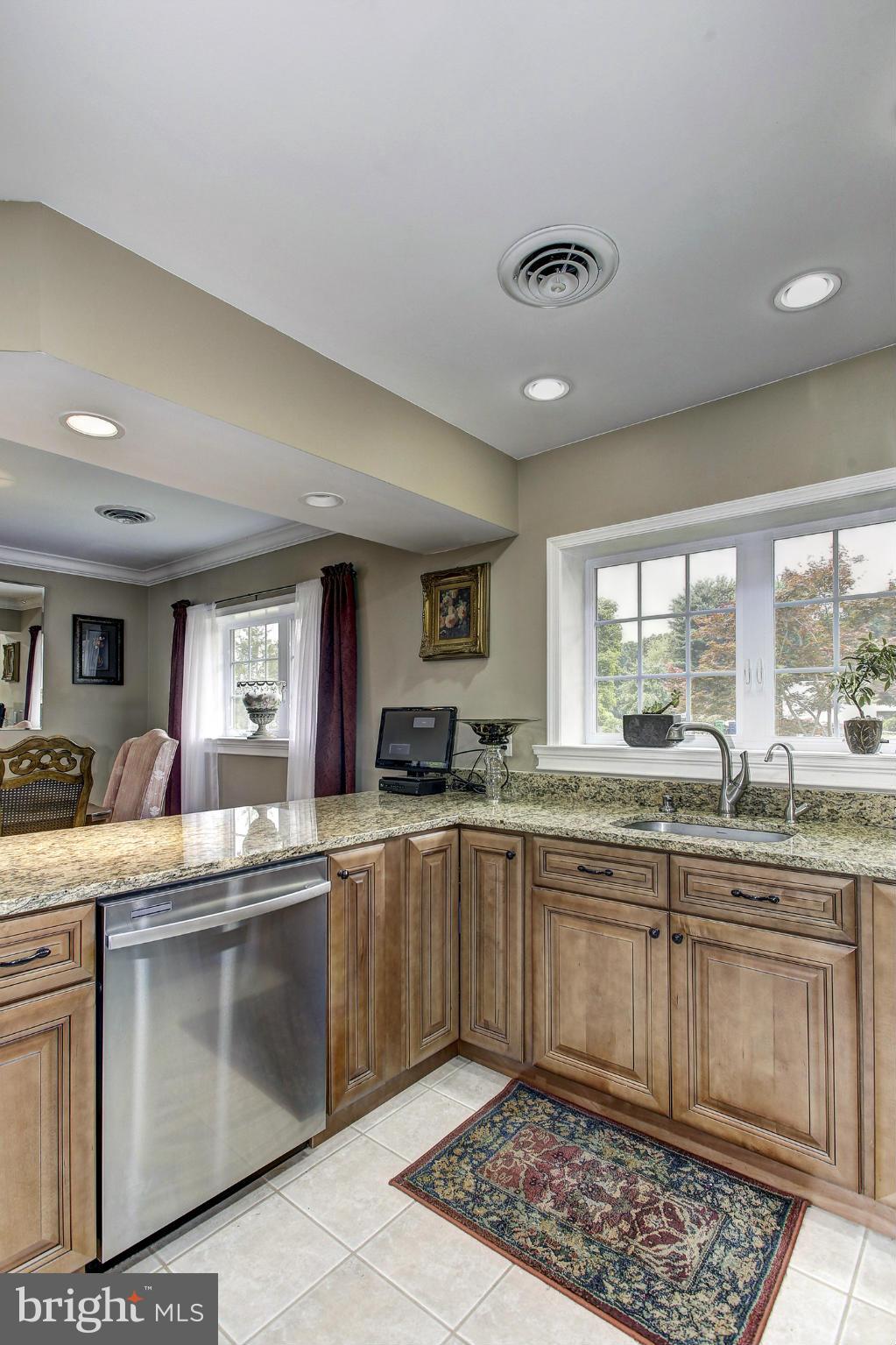 3701 Altondale Road Reisterstown, MD 21136 - Photo 7 of 29 a kitchen with a sink stove and cabinets