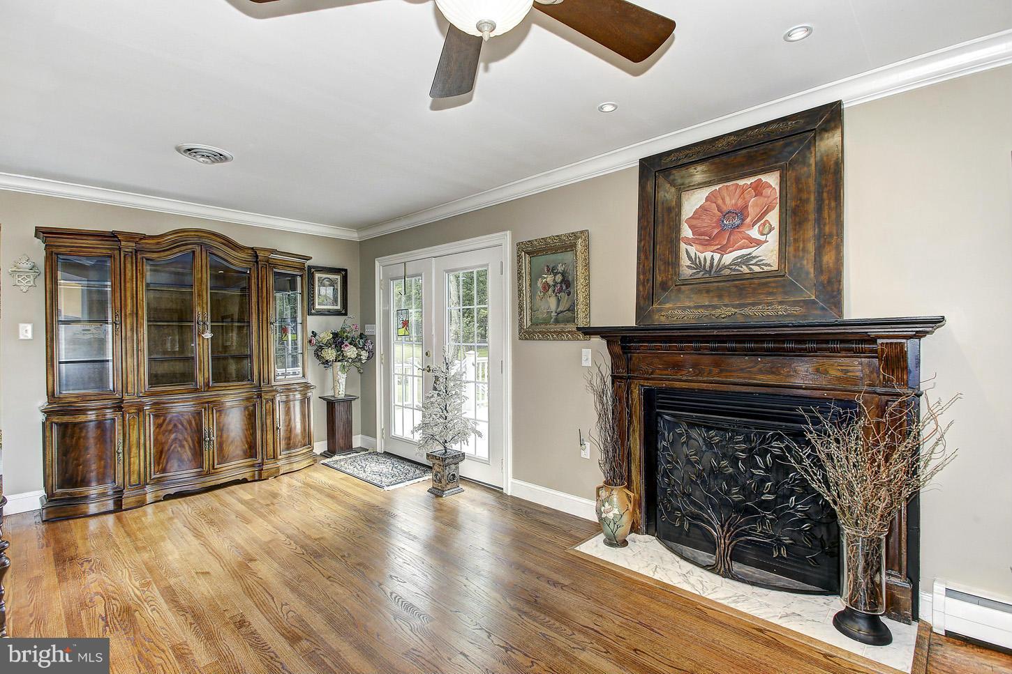 3701 Altondale Road Reisterstown, MD 21136 - Photo 10 of 29 a living room with furniture a fireplace and a flat screen tv