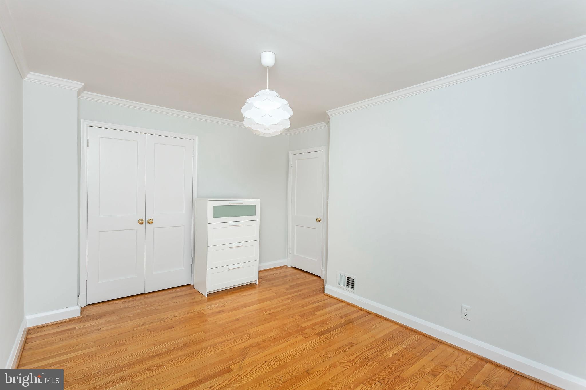 236 Stanmore Road Baltimore, MD 21212 - Photo 26 of 51 a view of empty room with wooden floor