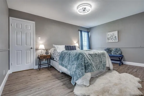 a bedroom with a bed and a table in it