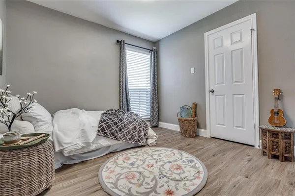 a bedroom with furniture and a window