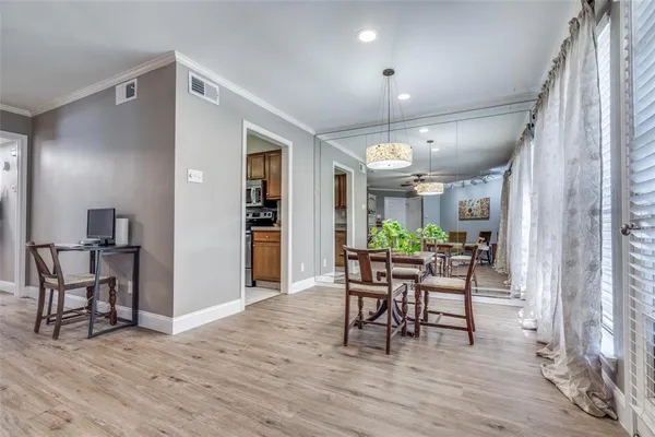 a dining room with furniture and window