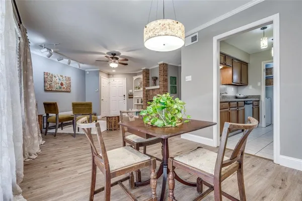 a dining room with furniture and window