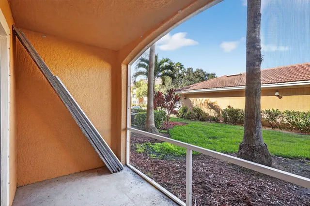 a view of a room with porch and wooden floor
