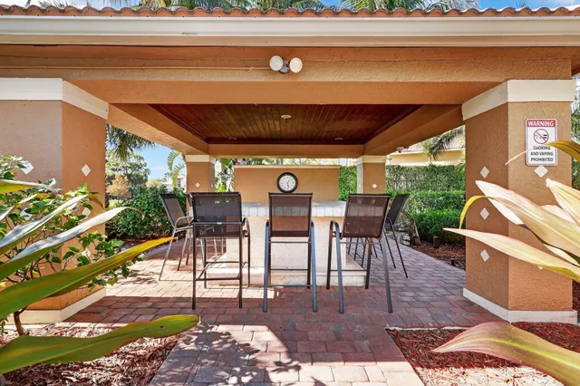 a view of a chairs and table in the patio