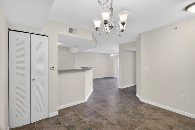 a view of a chandelier and a chandelier in a room