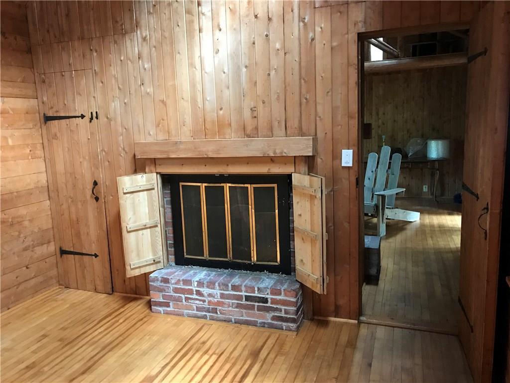 76 Raft Cove Road Lubec, ME 04652 - Photo 19 of 35 First floor bedroom with pellet...
