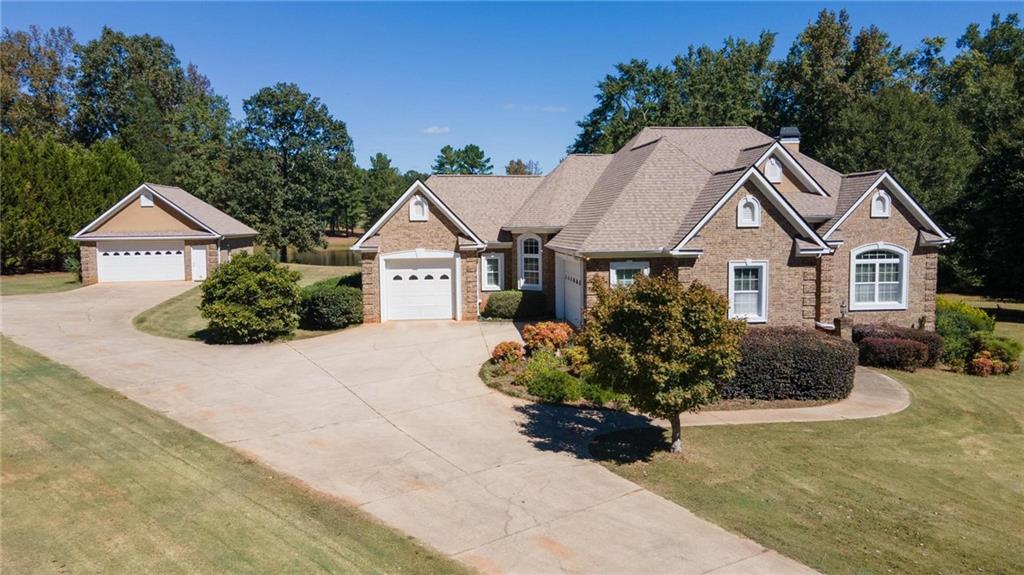 75 Walnut Ridge Court Covington, GA 30014 - Photo 1 of 1 a front view of a house with a garden
