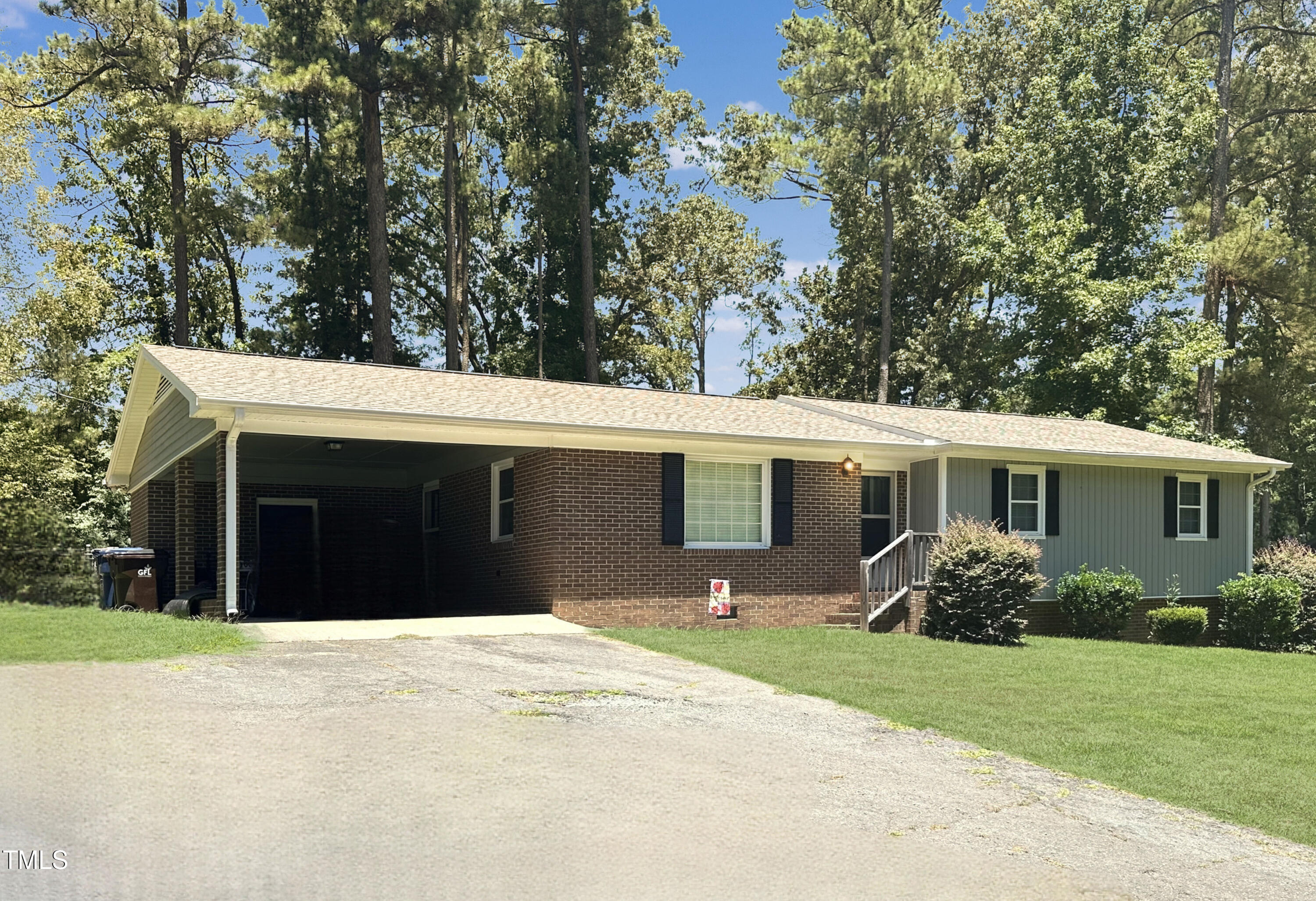 2400 Carbonton Road Sanford, NC 27330 - Photo 2 of 26 a front view of house with yard and trees in the background