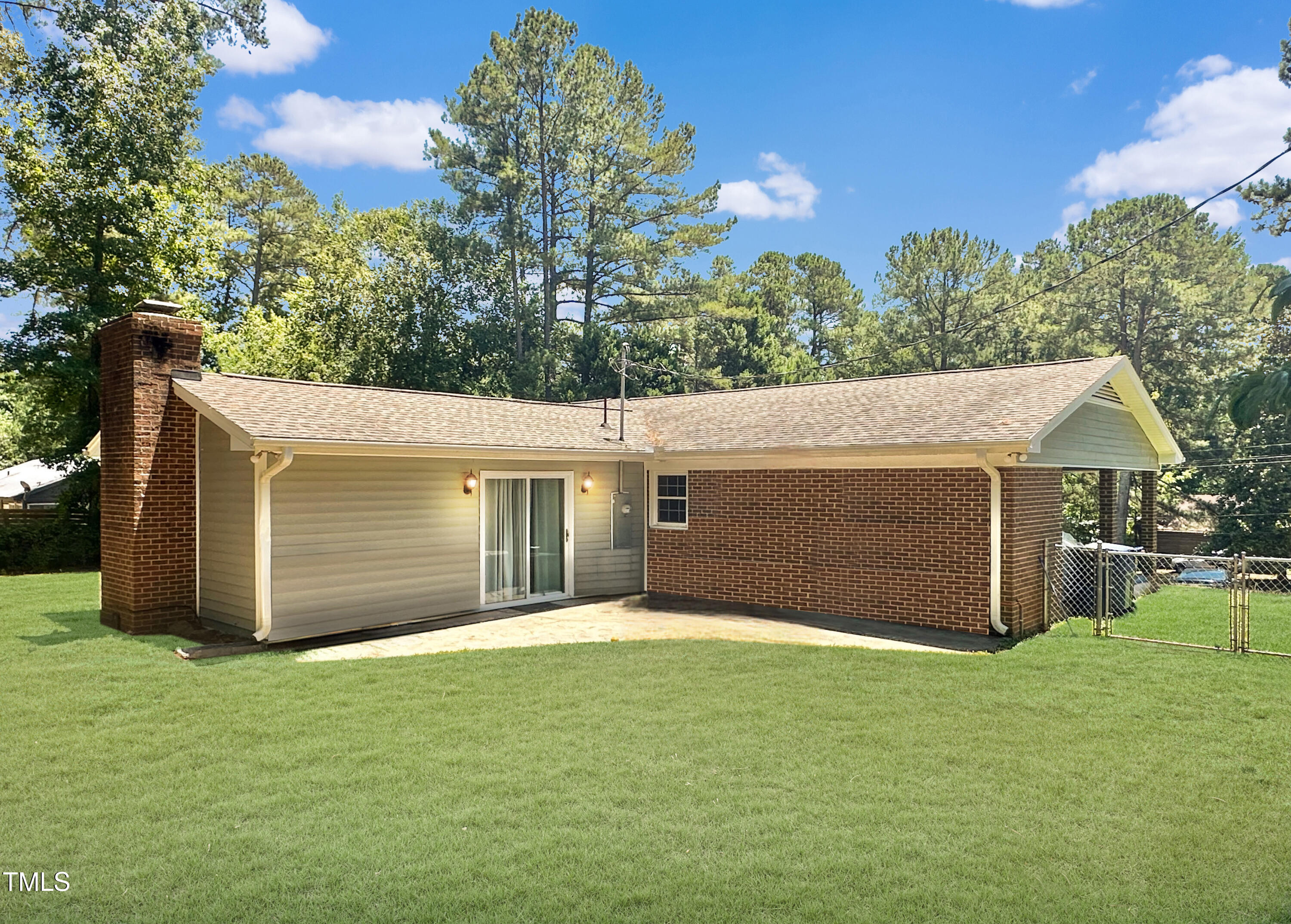 2400 Carbonton Road Sanford, NC 27330 - Photo 5 of 26 a front view of a house with a garden