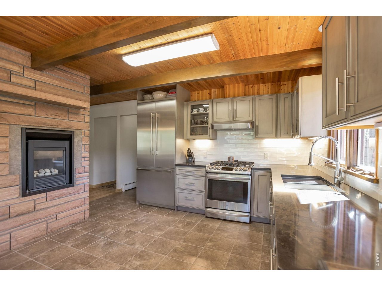 1477 Kiowa Road Lyons, CO 80540 - Photo 4 of 45 Kitchen w/propane fireplace