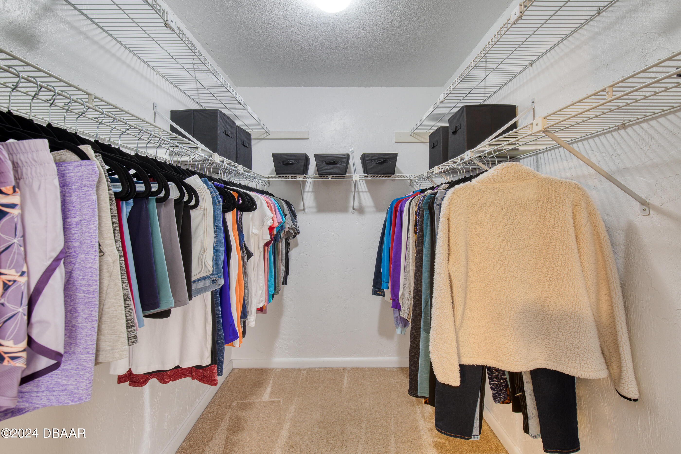 2304 Yule Tree Drive Edgewater, FL 32141 - Photo 22 of 34 a view of walk in closet with clothes and shoes